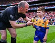 21 July 2024; Conor Moroney from Kilmaley in Clare on the pitch to present referee Johnny Murphy with the official match sliotar before the GAA Hurling All-Ireland Senior Championship Final between Clare and Cork at Croke Park in Dublin. Photo by Piaras Ó Mídheach/Sportsfile