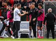 26 July 2024; Dundalk manager Jon Daly, left, and goalkeeping coach Peter Cherrie celebrate their side's first goal, scored by Daryl Horgan, not pictured, during the SSE Airtricity Men's Premier Division match between Bohemians and Dundalk at Dalymount Park in Dublin. Photo by Seb Daly/Sportsfile