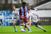26 July 2024; Frantz Pierrot of Drogheda in action against Ben McCormack, left, and Darragh Power of Waterford during the SSE Airtricity Men's Premier Division match between Drogheda United and Waterford at Weavers Park in Drogheda, Louth. Photo by Shauna Clinton/Sportsfile