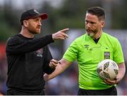 26 July 2024; Referee Eoghan O'Shea in conversation with Bohemians assistant manager Stephen O'Donnell as they leave the pitch at half-time during the SSE Airtricity Men's Premier Division match between Bohemians and Dundalk at Dalymount Park in Dublin. Photo by Seb Daly/Sportsfile