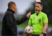 26 July 2024; Referee Eoghan O'Shea with Bohemians manager Alan Reynolds as they leave the pitch at half-time during the SSE Airtricity Men's Premier Division match between Bohemians and Dundalk at Dalymount Park in Dublin. Photo by Seb Daly/Sportsfile