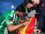 26 July 2024; Guillermo Almirall of Bray Wanderers signs a supporter's Spanish flag after the SSE Airtricity Men's First Division match between Bray Wanderers and Wexford at Carlisle Grounds in Bray, Wicklow. Photo by Thomas Flinkow/Sportsfile