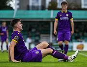 26 July 2024; Darragh Levingston of Wexford sits injured during the SSE Airtricity Men's First Division match between Bray Wanderers and Wexford at Carlisle Grounds in Bray, Wicklow. Photo by Thomas Flinkow/Sportsfile