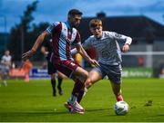 26 July 2024; Luke Heeney of Drogheda in action against Ryan Burke of Waterford during the SSE Airtricity Men's Premier Division match between Drogheda United and Waterford at Weavers Park in Drogheda, Louth. Photo by Shauna Clinton/Sportsfile