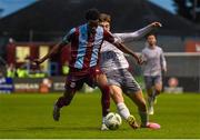 26 July 2024; Elicha Ahui of Drogheda is tackled by Shane Flynn of Waterford during the SSE Airtricity Men's Premier Division match between Drogheda United and Waterford at Weavers Park in Drogheda, Louth. Photo by Shauna Clinton/Sportsfile