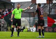26 July 2024; Referee Eoghan O'Shea and Adam McDonnell of Bohemians during the SSE Airtricity Men's Premier Division match between Bohemians and Dundalk at Dalymount Park in Dublin. Photo by Seb Daly/Sportsfile