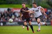 26 July 2024; Dayle Rooney of Bohemians in action against Daniel Pike of Dundalk during the SSE Airtricity Men's Premier Division match between Bohemians and Dundalk at Dalymount Park in Dublin. Photo by Seb Daly/Sportsfile