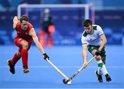 27 July 2024; John McKee of Team Ireland in action against Nicolas de Kerpel of Team Belgium during the men's pool B match between Team Ireland and Team Belgium at the Yves-du-Manoir Stadium during the 2024 Paris Summer Olympic Games in Paris, France. Photo by David Fitzgerald/Sportsfile