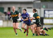 27 July 2024; Ella Sheridan of Cavan in action against Kathryn Ryan, left, and Clodagh Dwyer of Kerry during the ZuCar All-Ireland Ladies Football U-18 Championship A final match between Cavan and Kerry at O’Connor Park in Tullamore, Offaly. Photo by Michael P Ryan/Sportsfile