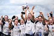 27 July 2024; Waterford captain Lia Ní Arta lifts the cup after her side's victory in the ZuCar All-Ireland Ladies Football U-18 Championship C final match between Armagh and Waterford at Kinnegad GAA in Westmeath. Photo by Piaras Ó Mídheach/Sportsfile