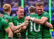 27 July 2024; Terry Kennedy of Team Ireland, 10, celebrates with team-mates, from left, Gavin Mullin, Niall Comerford and Zac Ward, after scoring their side's third try during the men's placing 5-8 match between Team Ireland and Team USA at the Stade de France during the 2024 Paris Summer Olympic Games in Paris, France. Photo by Sandra Ruhaut/Sportsfile