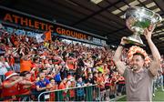 28 July 2024; Armagh captain Aidan Forker holds the Sam Maguire Cup aloft at the homecoming celebrations of the All-Ireland Senior Football Champions at BOX-IT Athletic Grounds in Armagh. Photo by Ramsey Cardy/Sportsfile