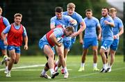 31 July 2024; John McKee and Ben Brownlee during a Leinster rugby training session at UCD in Dublin. Photo by Ramsey Cardy/Sportsfile