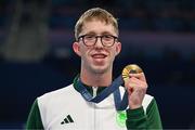 30 July 2024; Men's 800m freestyle gold medallist Daniel Wiffen of Team Ireland celebrates with his medal at the Paris La Défense Arena during the 2024 Paris Summer Olympic Games in Paris, France. Photo by Brendan Moran/Sportsfile