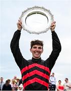 31 July 2024; Jockey Donagh Meyler celebrates with the trophy after winning the Tote Galway Plate on Pinkerton during day three of the Galway Races Summer Festival at Ballybrit Racecourse in Galway. Photo by Seb Daly/Sportsfile