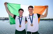 1 August 2024; Philip Doyle, right, and Daire Lynch of Team Ireland celebrate with their bronze medals after the men's double sculls A final at Vaires-sur-Marne Nautical Stadium during the 2024 Paris Summer Olympic Games in Paris, France. Photo by Stephen McCarthy/Sportsfile