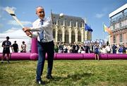 1 August 2024; Tánaiste, Minister for Foreign Affairs and Minister for Defence, Micheál Martin, TD, demonstrates his hurling skills at Fesport Festival at the Cháteau de Vincennes during the 2024 Paris Summer Olympic Games in Paris, France. Photo by Sam Barnes/Sportsfile