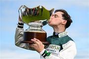 1 August 2024; Jockey JJ Slevin kisses the trophy after winning the Guinness Galway Hurdle Handicap on Nurburgring during day four of the Galway Races Summer Festival at Ballybrit Racecourse in Galway. Photo by Seb Daly/Sportsfile