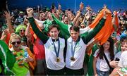 2 August 2024; Paul O'Donovan, left, and Fintan McCarthy of Team Ireland celebrate with fans after winning the men's lightweight double sculls finals A at Vaires-sur-Marne Nautical Stadium during the 2024 Paris Summer Olympic Games in Paris, France. Photo by Brendan Moran/Sportsfile