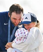 4 August 2024; Gold medalist Scottie Scheffler of Team United States, with his wife Meredith, and son Bennett, after the men's individual stroke play final round at Le Golf National during the 2024 Paris Summer Olympic Games in Paris, France. Photo by Brendan Moran/Sportsfile