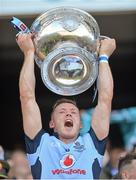 22 September 2013; Dublin's Paul Flynn lifts the Sam Maguire Cup following their victory. GAA Football All-Ireland Senior Championship Final, Dublin v Mayo, Croke Park, Dublin. Picture credit: Stephen McCarthy / SPORTSFILE