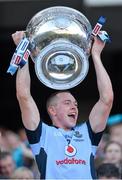 22 September 2013; Dublin's Dean Rock lifts the Sam Maguire Cup following their victory. GAA Football All-Ireland Senior Championship Final, Dublin v Mayo, Croke Park, Dublin. Picture credit: Stephen McCarthy / SPORTSFILE