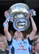 22 September 2013; Dublin's Jack McCaffrey lifts the Sam Maguire Cup following their victory. GAA Football All-Ireland Senior Championship Final, Dublin v Mayo, Croke Park, Dublin. Picture credit: Stephen McCarthy / SPORTSFILE