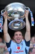 22 September 2013; Dublin's Kevin O'Brien lifts the Sam Maguire Cup following their victory. GAA Football All-Ireland Senior Championship Final, Dublin v Mayo, Croke Park, Dublin. Picture credit: Stephen McCarthy / SPORTSFILE