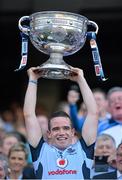 22 September 2013; Dublin's Ger Brennan lifts the Sam Maguire Cup following their victory. GAA Football All-Ireland Senior Championship Final, Dublin v Mayo, Croke Park, Dublin. Picture credit: Stephen McCarthy / SPORTSFILE