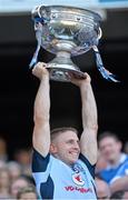 22 September 2013; Dublin's Eoghan O'Gara lifts the Sam Maguire Cup following their victory. GAA Football All-Ireland Senior Championship Final, Dublin v Mayo, Croke Park, Dublin. Picture credit: Stephen McCarthy / SPORTSFILE