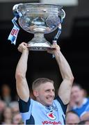 22 September 2013; Dublin's Eoghan O'Gara lifts the Sam Maguire Cup following their victory. GAA Football All-Ireland Senior Championship Final, Dublin v Mayo, Croke Park, Dublin. Picture credit: Stephen McCarthy / SPORTSFILE