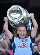 22 September 2013; Dublin's Jonny Cooper lifts the Sam Maguire Cup following their victory. GAA Football All-Ireland Senior Championship Final, Dublin v Mayo, Croke Park, Dublin. Picture credit: Stephen McCarthy / SPORTSFILE