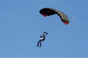 22 September 2013; A member of the Irish Parachute Club arrives in to Croke Park with the match ball ahead of the game. GAA Football All-Ireland Senior Championship Final, Dublin v Mayo, Croke Park, Dublin. Picture credit: Stephen McCarthy / SPORTSFILE