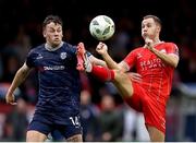 5 August 2024; Liam Burt of Shelbourne in action against Ben Doherty of Derry City during the SSE Airtricity Men's Premier Division match between Shelbourne and Derry City at Tolka Park in Dublin. Photo by Thomas Flinkow/Sportsfile