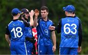 7 August 2024; Gavin Hoey of Leinster Lightning, centre, is congratulated by team mates after taking the wicket of Ryan Joyce of Munster Reds by LBW during the Inter-Provincial IP20 Trophy match between Munster Reds and Leinster Lightning at The Mardyke in Cork. Photo by Stephen Marken/Sportsfile