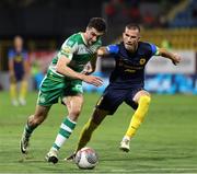 8 August 2024; Neil Farrugia of Shamrock Rovers in action against David Zec of Celje during the UEFA Europa League third qualifying round first leg match between Celje and Shamrock Rovers at Stadion Celje in Celje, Slovenia. Photo by Vid Ponikvar/Sportsfile