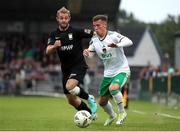 9 August 2024; Evan McLaughlin of Cork City in action against Alexander Byrne of Athlone Town during the SSE Airtricity Men's First Division match between Cork City and Athlone Town at Turner's Cross in Cork. Photo by Michael P Ryan/Sportsfile