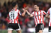 9 August 2024; Danny Mullen of Derry City celebrates with teammate Ciarán Coll, right, after scoring their side's first goal during the SSE Airtricity Men's Premier Division match between Derry City and Dundalk at The Ryan McBride Brandywell Stadium in Derry. Photo by Ramsey Cardy/Sportsfile