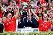 11 August 2024; Cork joint-captains Molly Lynch, left, and Meabh Cahalane lift the O'Duffy Cup after after the Glen Dimplex Camogie All-Ireland Senior Camogie Championship final between Cork and Galway at Croke Park in Dublin. Photo by Piaras Ó Mídheach/Sportsfile