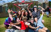 16 August 2024; Festival goers from Cork pictured at Heineken® House at Electric Picnic in Stradbally, Laois. Making its Irish debut after huge success at global festivals, Heineken® House puts festival goers front and centre with elevated areas, immersive dj experience and raised dance platforms. Production will elevate this unique build, with stunning visual and lighting design to create a spectacle that is a must see this Electric Picnic. Heineken® continues to champion Irish talent with a full lineup of local talent across the three days. Photo by Ramsey Cardy/Sportsfile