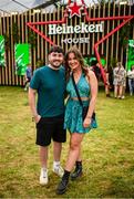 16 August 2024; Festival goers Patrick Barry, from Conna, Cork, and Fiona Daly, Drumtarriff, Cork, pictured at Heineken® House at Electric Picnic in Stradbally, Laois. Making its Irish debut after huge success at global festivals, Heineken® House puts festival goers front and centre with elevated areas, immersive dj experience and raised dance platforms. Production will elevate this unique build, with stunning visual and lighting design to create a spectacle that is a must see this Electric Picnic. Heineken® continues to champion Irish talent with a full lineup of local talent across the three days. Photo by Ramsey Cardy/Sportsfile