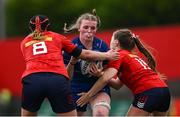 17 August 2024; Erin McFadden of Leinster is tackled by Sally Kelly, left, and Clodagh McCarthy of Munster during the U18 Girls Interprovincial Championship Round Two match between Munster and Leinster at Virgin Media Park in Cork. Photo by Shauna Clinton/Sportsfile