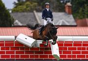 17 August 2024; Elliott Smith of Great Britain competing on Flamboyant III, fails to make a clearance of 2.15m during the Defender Puissance during the Dublin Horse Show at the RDS Arena in Dublin. Photo by Tyler Miller/Sportsfile