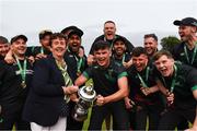 17 August 2024; Cricket Ireland president Stella Downes presents the cup to Phoenix captain Adam Chester after the Butlers Irish Senior Cup final match between Merrion and Phoenix at The Mardyke in Cork. Photo by Tom Beary/Sportsfile