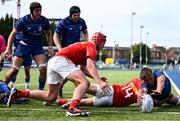 18 August 2024; Michael Bolger of Leinster scores his side's second try despite the efforts of Keelan Dunne of Munster during the U18 Club's Interprovincial Round One match between Leinster and Munster at Energia Park in Dublin. Photo by Shauna Clinton/Sportsfile