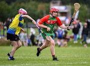 25 August 2024; Lucy Geraghty of Inniskeen, Monaghan, in action against Róisín McDonnell of Clarecastle-Ballyea, Clare, left, in the Camogie U14 & O10 Girls during the Cairn Community Games National Outdoor Teams Finals at SETU Pitches and Running Track in Carlow. Photo by Piaras Ó Mídheach/Sportsfile