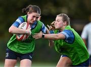 27 August 2024; Ellie O'Sullivan is tackled by Ciara Faulkner during a Leinster rugby women's training session at The High School in Rathgar, Dublin. Photo by Shauna Clinton/Sportsfile