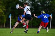 28 August 2024; Channing Dafel of Midlands in action against Killian James and Ross Murphy, 16, of North Midlands during the BearingPoint Shane Horgan Cup round 1 match between North Midlands and Midlands at SETU Carlow Campus in Carlow. Photo by Piaras Ó Mídheach/Sportsfile