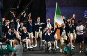 28 August 2024; Ireland are led by flagbearers Orla Comerford, right, and Colin Judge during the opening ceremony of the Paris 2024 Paralympic Games at Place de la Concorde in Paris, France. Photo by Ramsey Cardy/Sportsfile