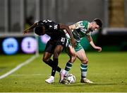 29 August 2024; Neil Farrugia of Shamrock Rovers in action against Abdul Rahman Baba of PAOK during the UEFA Europa League play-off second leg match between Shamrock Rovers and PAOK at Tallaght Stadium in Dublin. Photo by Seb Daly/Sportsfile